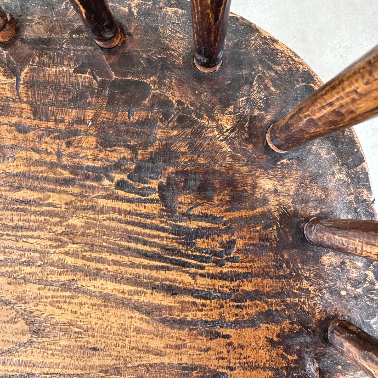 An 18th century elm seated spindle back Windsor armchair.