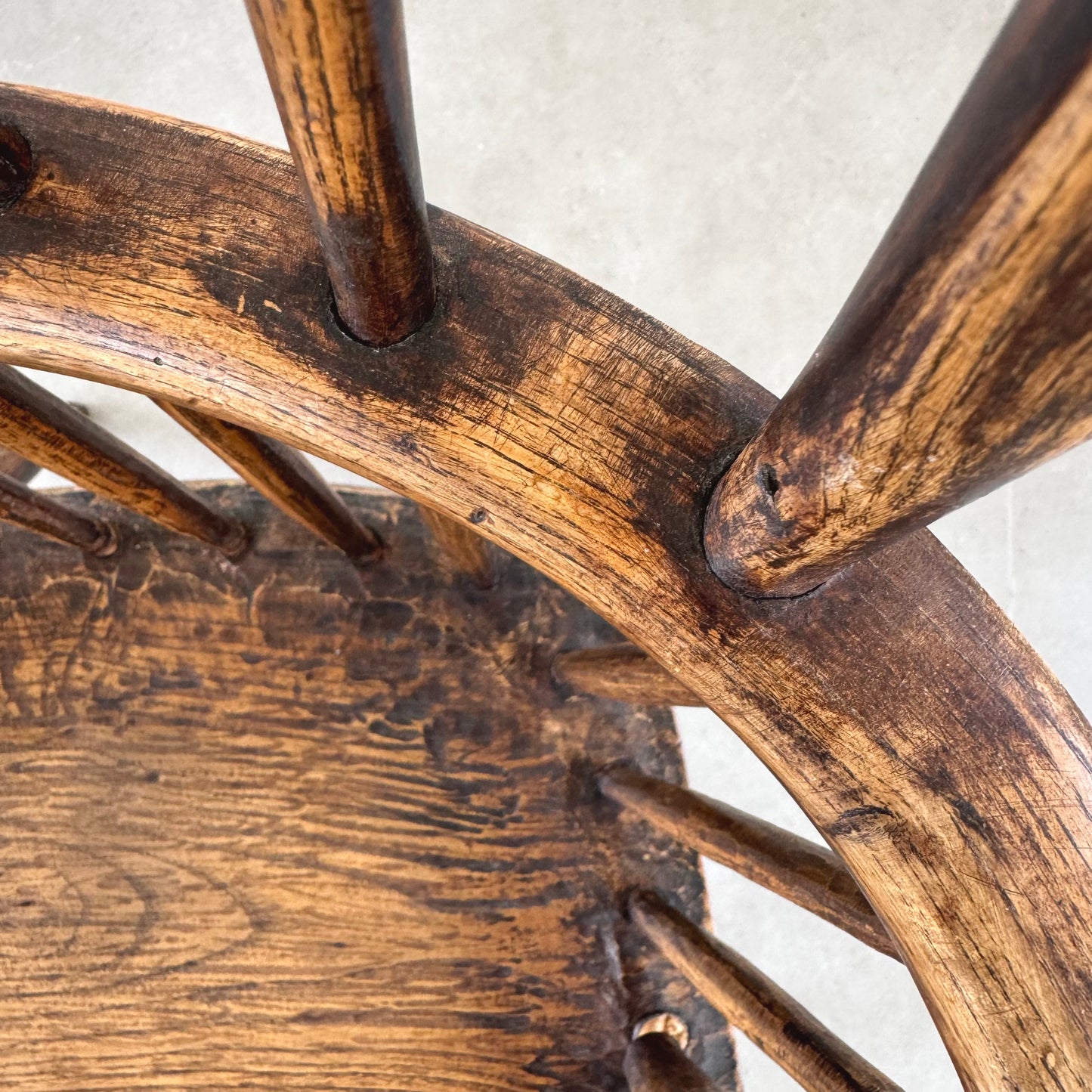 An 18th century elm seated spindle back Windsor armchair.