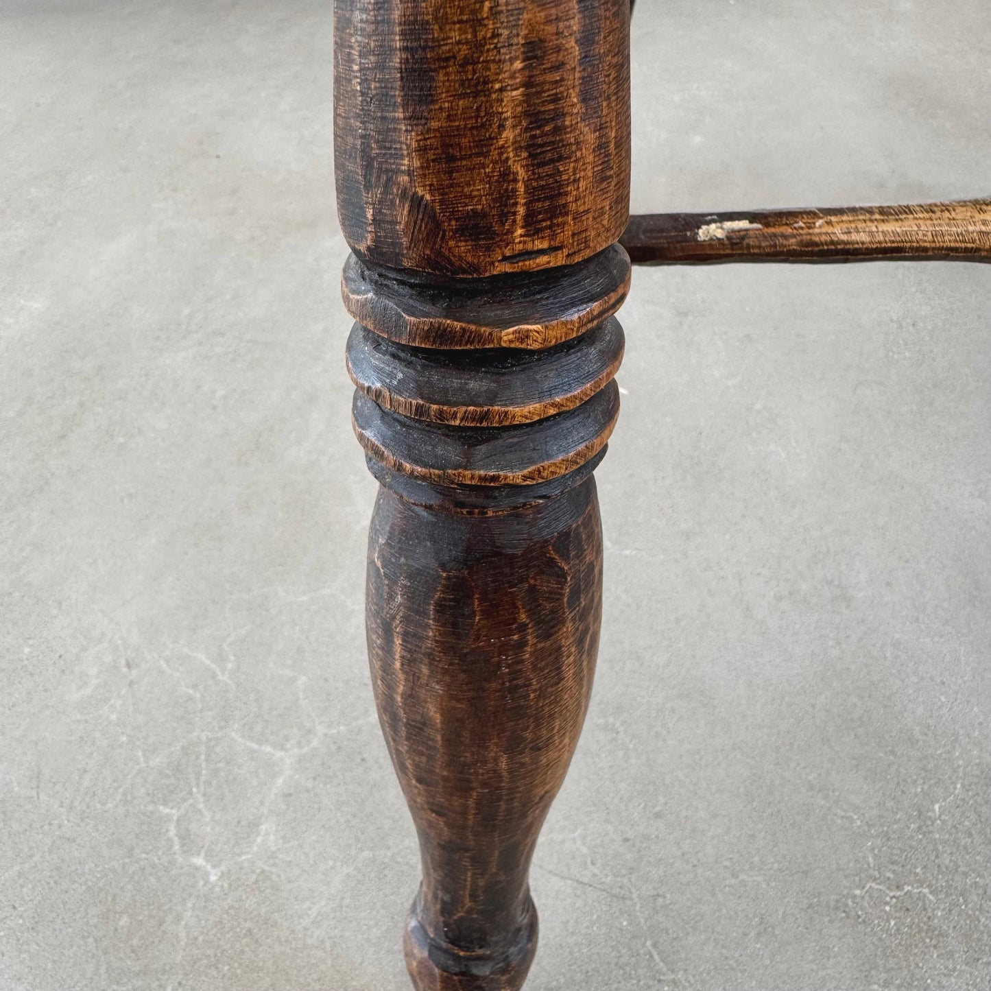 An 18th century elm seated spindle back Windsor armchair.